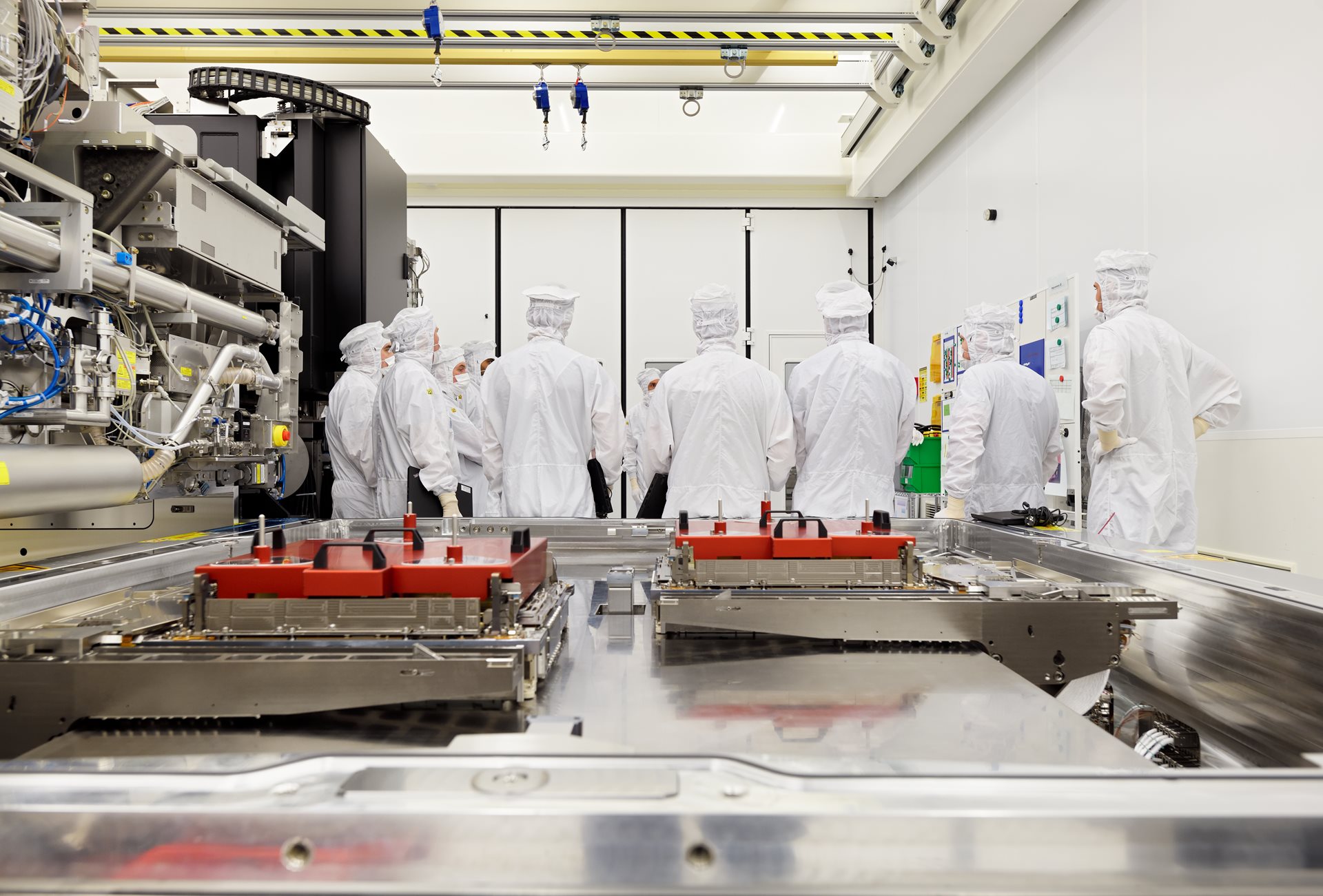 ASMLengineers work on EUV system, overlooking a wafer table.