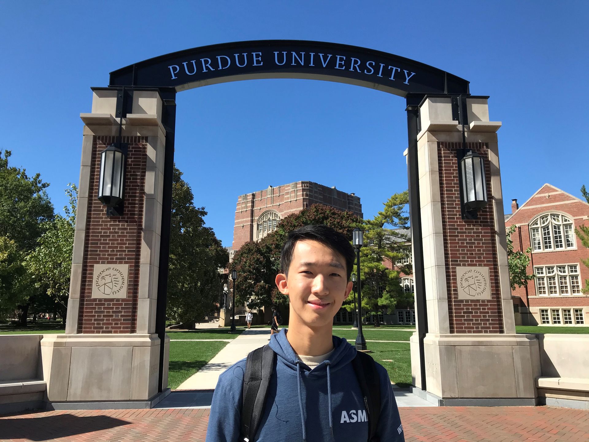 ASMLintern Jason Jeon poses in front of Purdue University in Indiana.