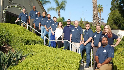 Members of the ASML Veterans employee network stand outside an ASML office in San Diego, California.